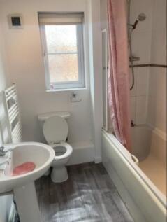 A clean and well-maintained bathroom featuring ...