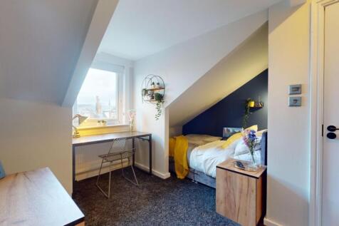 This charming double bedroom features a cozy la...