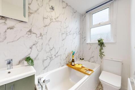 This beautifully designed bathroom features ele...