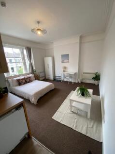 Bright and spacious master bedroom featuring a ...