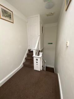 A clean and well-maintained indoor staircase ar...