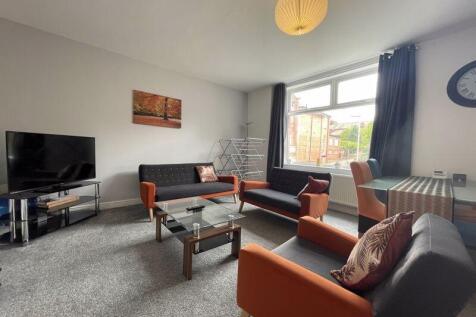 Bright and welcoming living room featuring comf...