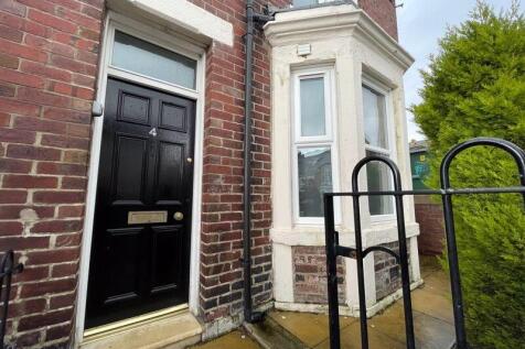 A charming brick terraced house entrance with a...