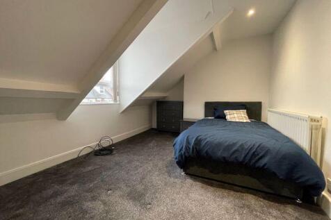 A clean and well-maintained single toilet room ...