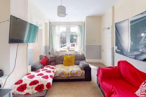 Bright and inviting living room featuring comfo...