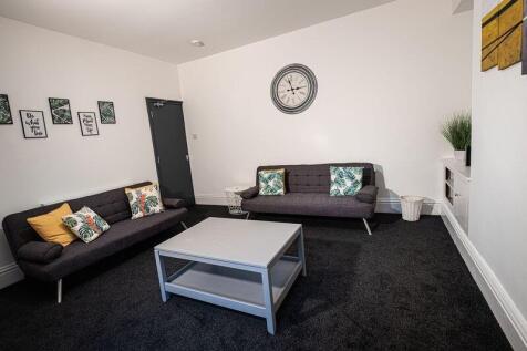 A modern living room featuring two comfortable ...
