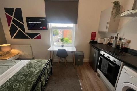 Bright and modern double bedroom featuring a co...