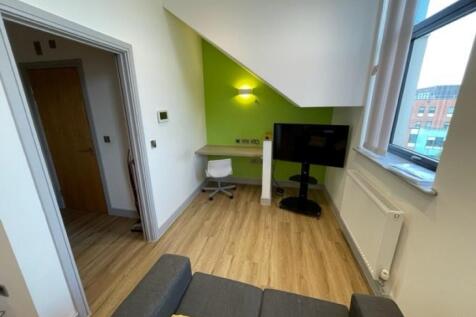 A bright and clean communal lounge featuring mo...