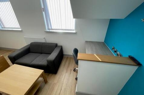 A modern and bright communal lounge area featur...