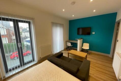 Bright and spacious master bedroom featuring a ...