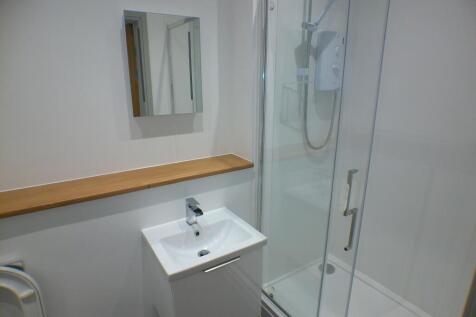 Bright and modern bathroom featuring a sleek wh...