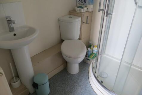 A clean and functional bathroom featuring a cor...