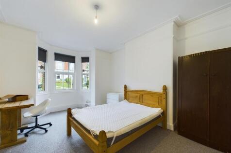 Bright and inviting master bedroom featuring a ...