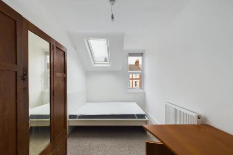 Bright and airy double bedroom featuring a larg...