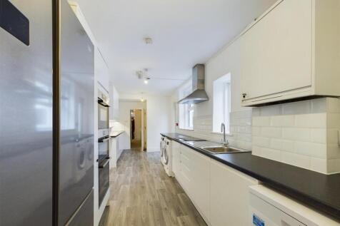 Bright and modern galley kitchen featuring slee...