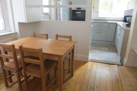 Bright and functional kitchen area with natural...