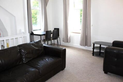 Bright and welcoming living room featuring comf...