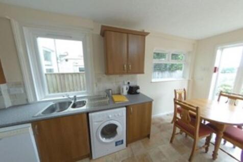 Bright and tidy kitchen featuring natural light...