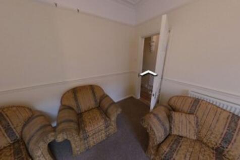 Cozy living room featuring comfortable armchair...