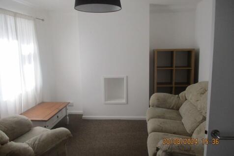 A bright living room featuring comfortable cush...