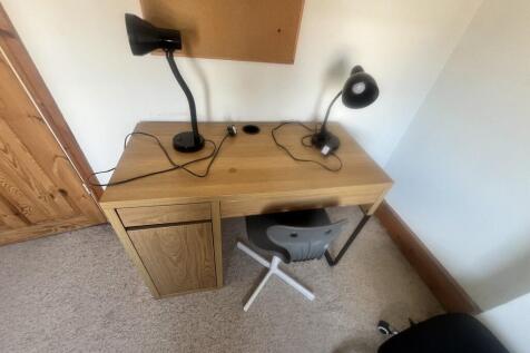 A neat and functional workspace featuring a woo...