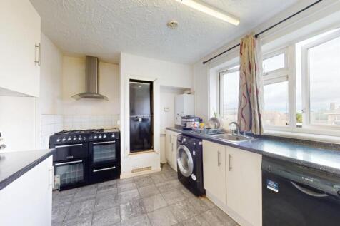 Bright and well-equipped kitchen featuring ampl...