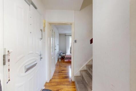 A clean and well-maintained hallway featuring p...