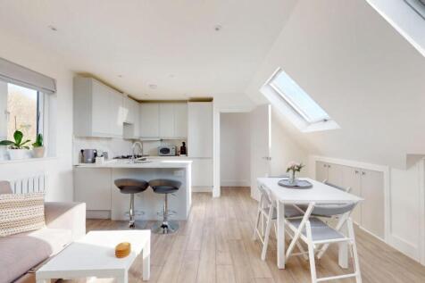 Bright and modern open-plan living space with s...