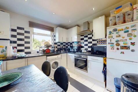 Bright and modern kitchen featuring a stylish b...