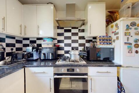 A well-equipped kitchen featuring modern applia...