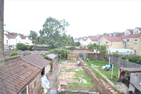 A spacious garden area with well-maintained lan...