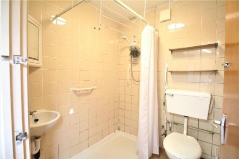 Bright and functional bathroom featuring a show...