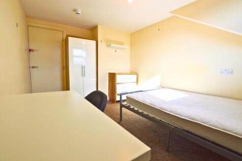 A bright and tidy single bedroom featuring a cl...