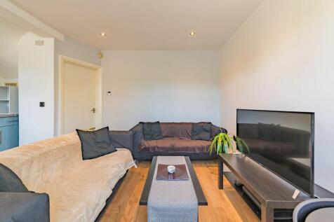 A comfortable living room featuring two sofas w...