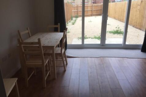 A spacious and bright living room with access t...