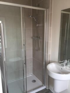 A modern and clean bathroom featuring a spaciou...