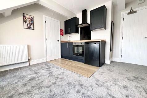 A modern and tidy kitchen area featuring sleek ...