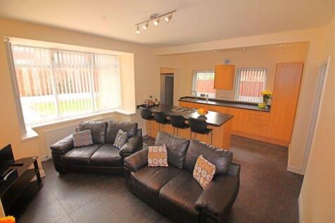 Bright and inviting open-plan living room with ...