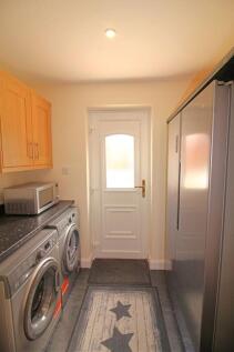A clean and well-maintained laundry room featur...