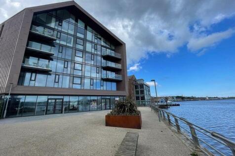 Modern waterfront property with large balconies...