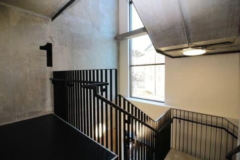 Bright and modern staircase area with ample nat...