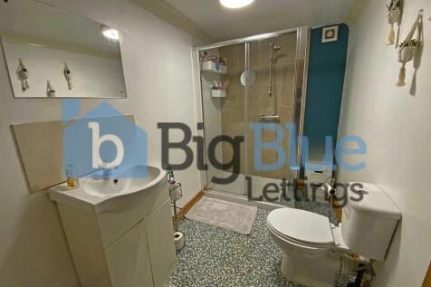 A clean and modern bathroom featuring a white t...