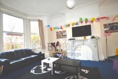 Bright and inviting living room featuring a lar...