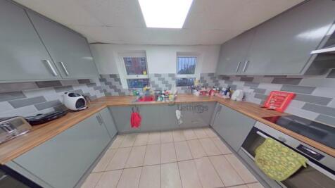 Modern kitchen with ample counter space, built-...