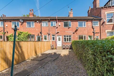 Well-maintained terraced house exterior with a ...