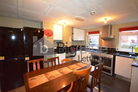 A bright and well-equipped kitchen featuring mo...