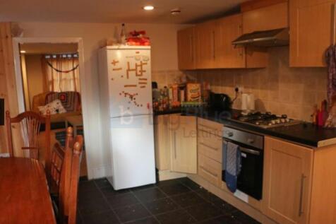 A warm and functional kitchen featuring wooden ...
