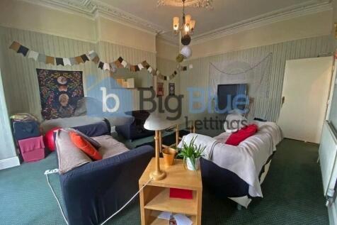 A spacious and inviting master bedroom featurin...