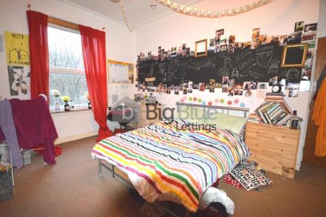 A bright and cozy double bedroom featuring a st...