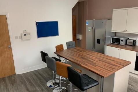 Bright and modern kitchen featuring a spacious ...